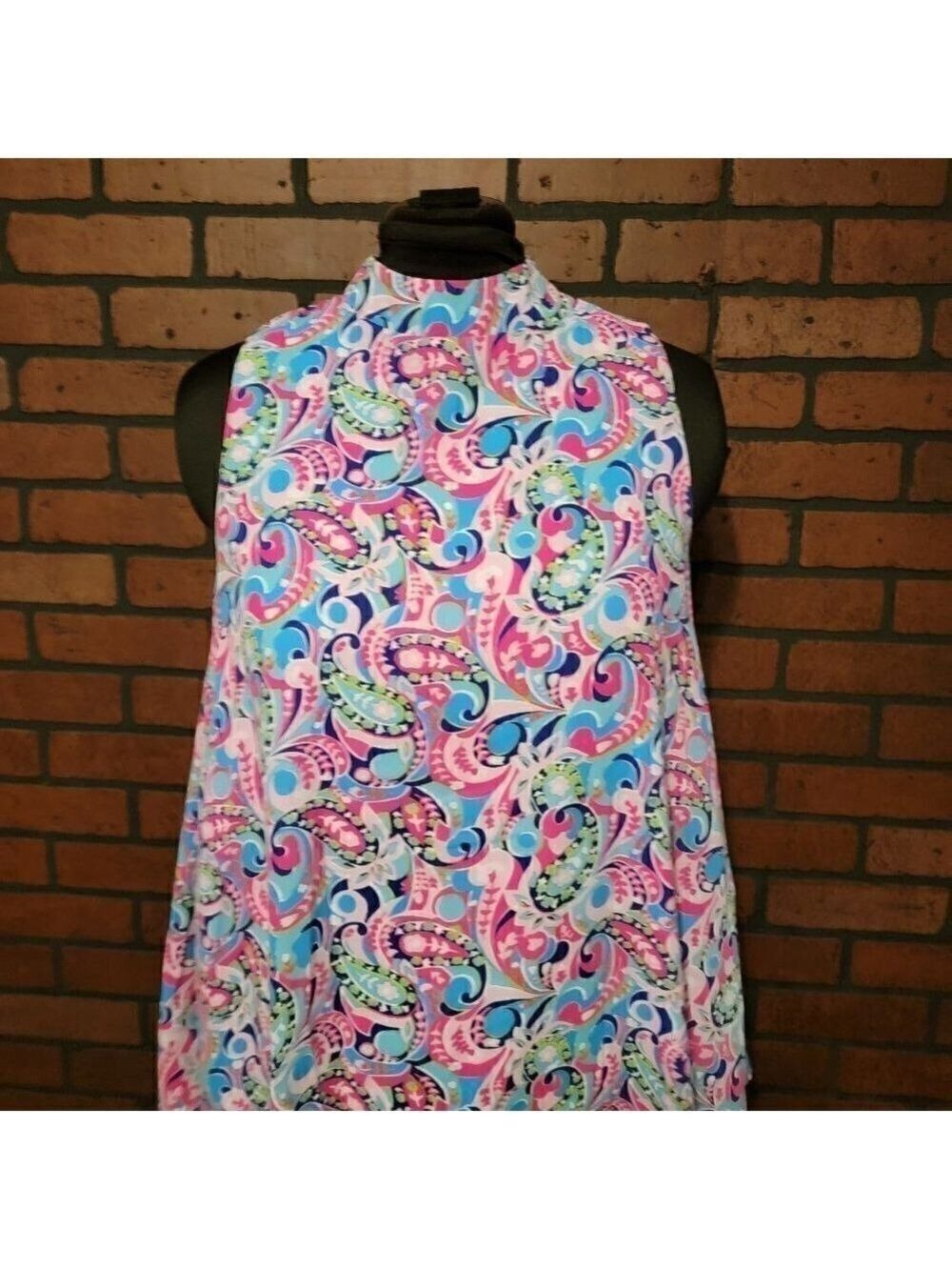 Altar'd State bright floral paisley sleeveless top. Button neck- swing style to